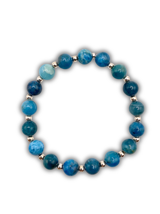 A blue apatite 8mm beaded bracelet with sterling silver accent beads between each 8mm bead.