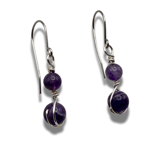 Two purple amethyst beaded earrings wrapped in silver plate wire on stainless steel hooks